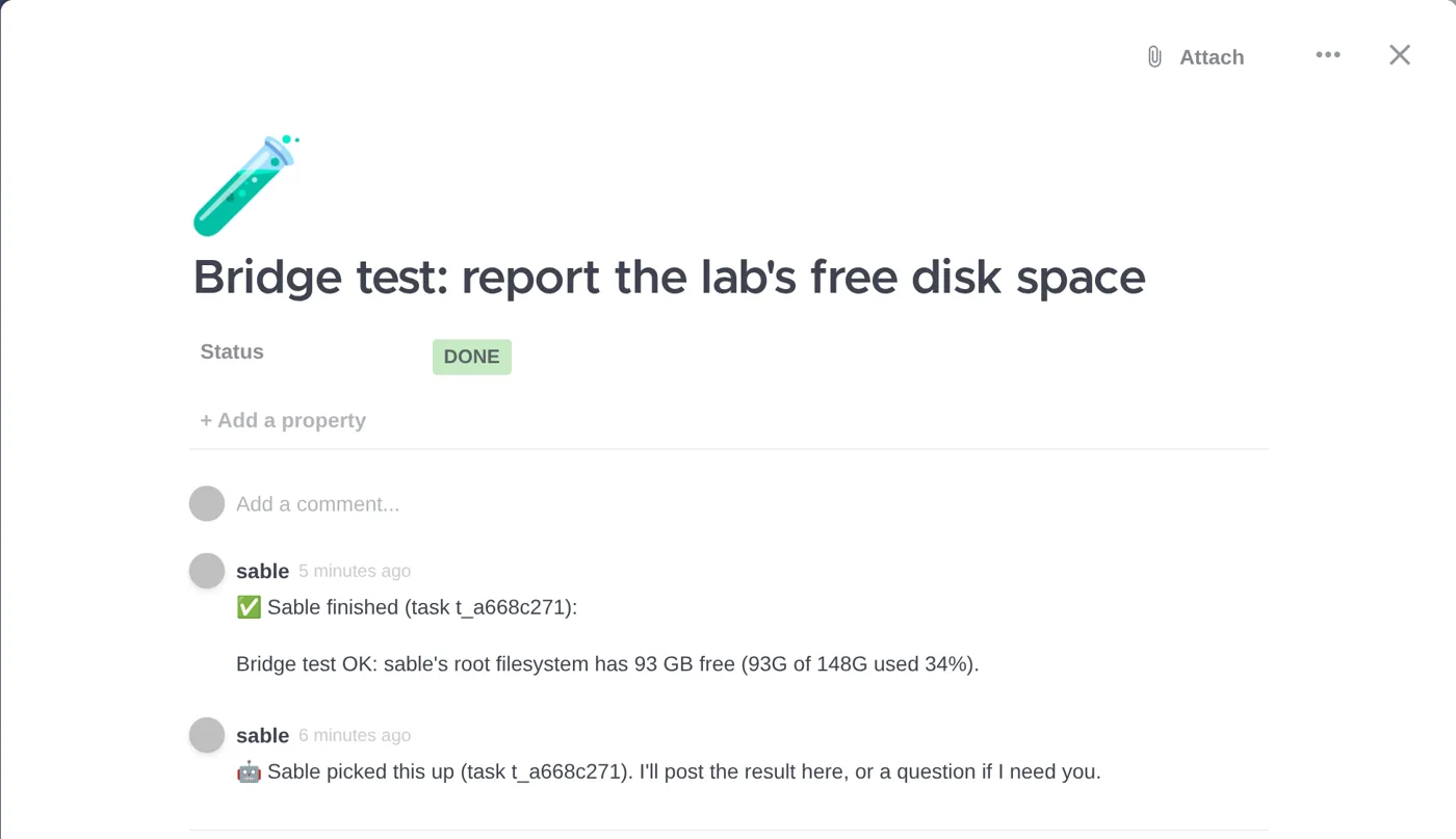 A Focalboard card titled Bridge test: report the lab's free disk space, status Done, with two comments from the agent: one saying it picked up the task and one reporting 93 GB free.