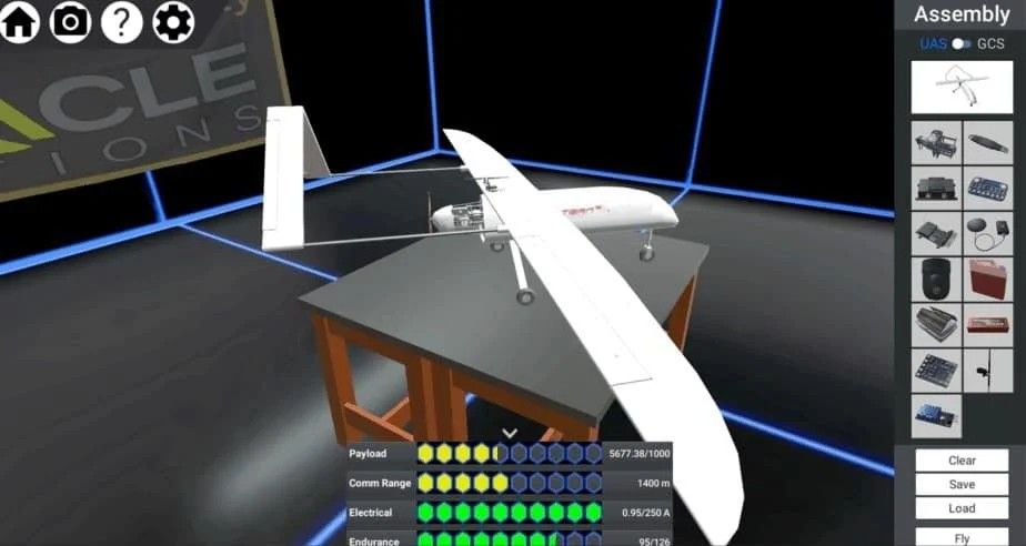 ERAU Virtual HUB assembly screen: white fixed-wing UAV model on a table in a blue grid virtual room, Assembly panel with component icons and Clear, Save, Load, Fly buttons, status readout showing Payload, Comm Range, Electrical and Endurance metrics