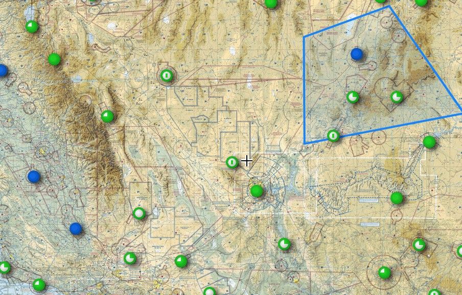 NASA UTM concept map: topographic terrain with drone flight paths marked by circular pins around a central crosshair, and a blue polygonal geofence enclosing an operating area