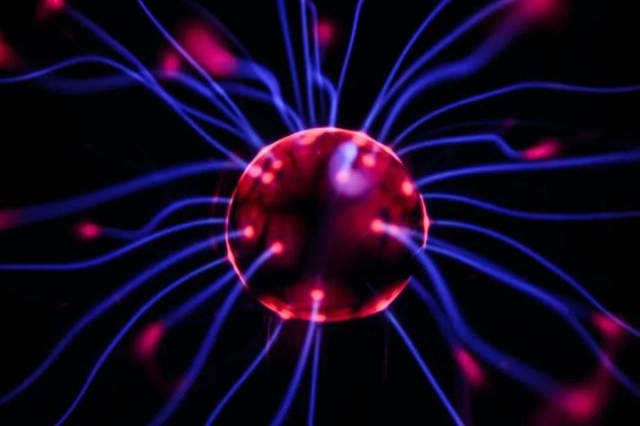 A plasma ball with glowing filaments, like a network of neurons